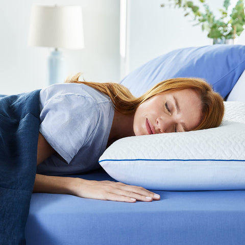 Sleep Innovations pillow staged on made bed demonstrating comfortable sleep setup