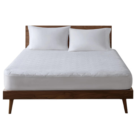 Sleep Philosophy lifestyle bedroom setting showing the pad in a styled bed for natural comfort