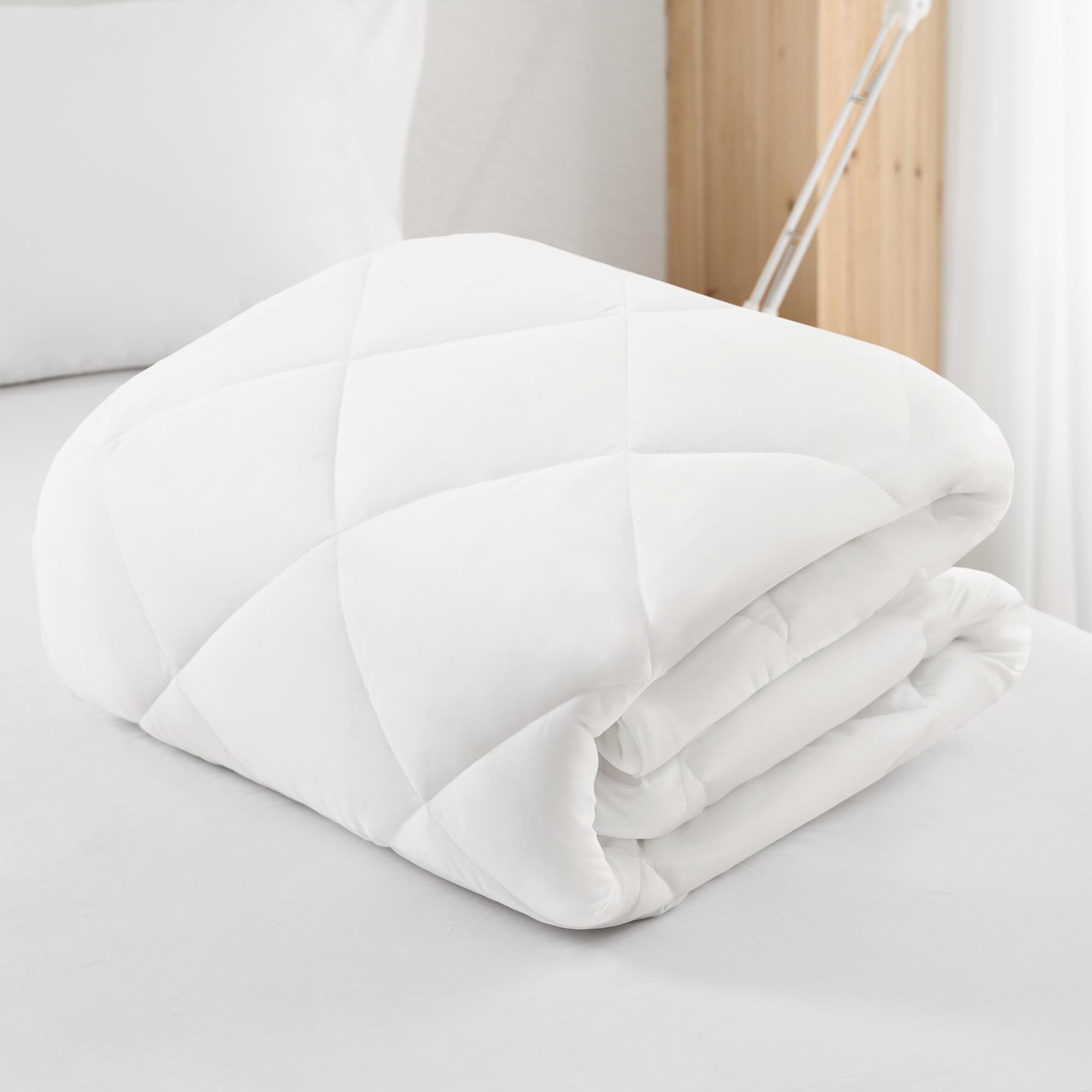 Sleep Philosophy wash care tag close-up promoting simple machine-wash maintenance