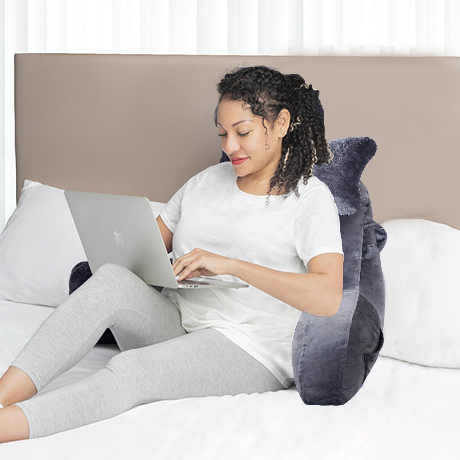 SLIGUY next to book and remote showing scale and practical everyday use