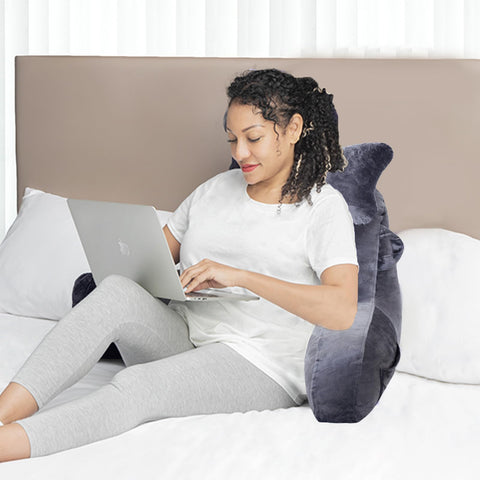 SLIGUY next to book and remote showing scale and practical everyday use