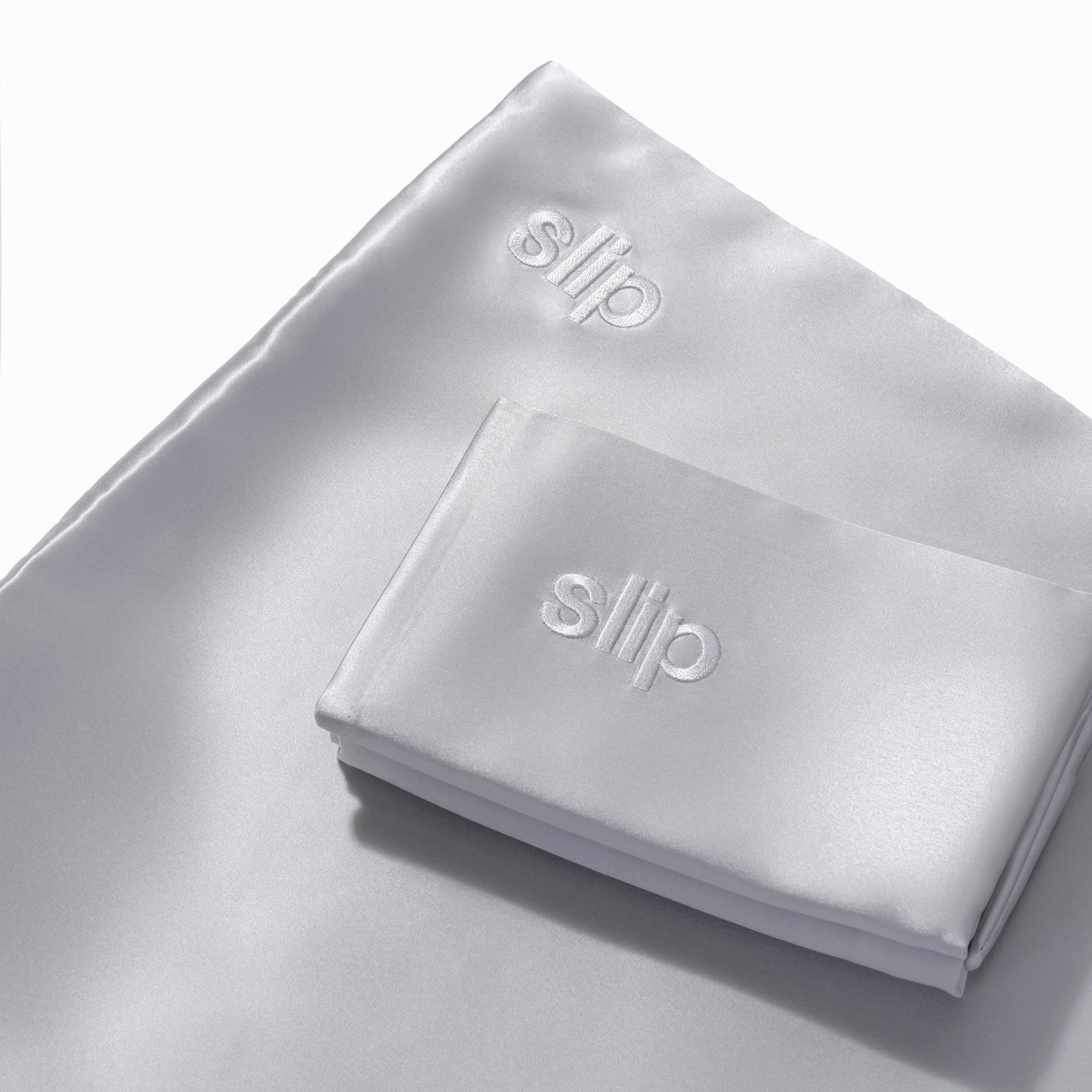 Slip pillowcase care label showing washing instructions for maintaining sheen and shape