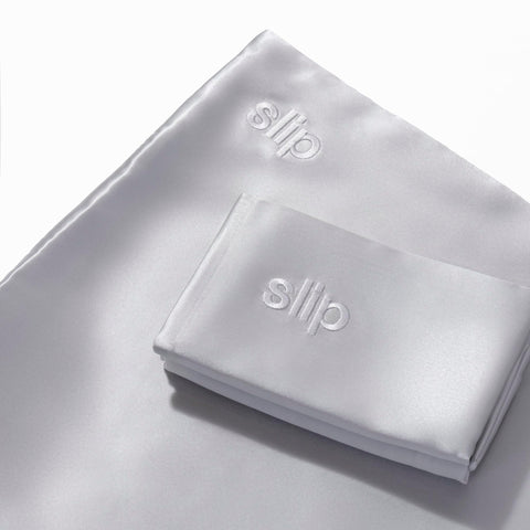 Slip pillowcase care label showing washing instructions for maintaining sheen and shape