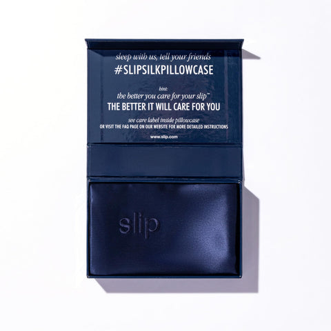 SLIP navy pillowcase care label close-up showing wash instructions