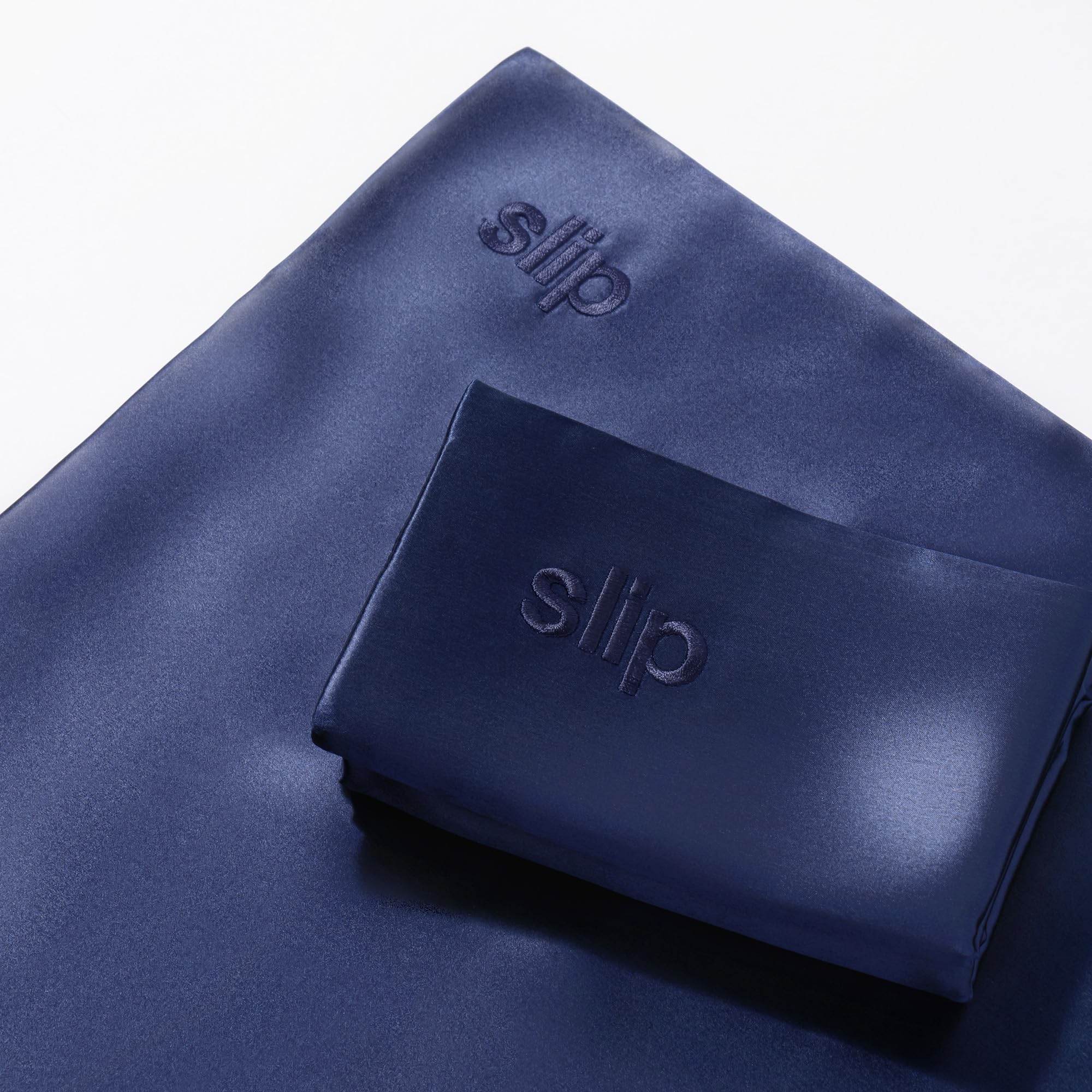 SLIP navy pillowcase comparison showing fewer sleep creases benefit