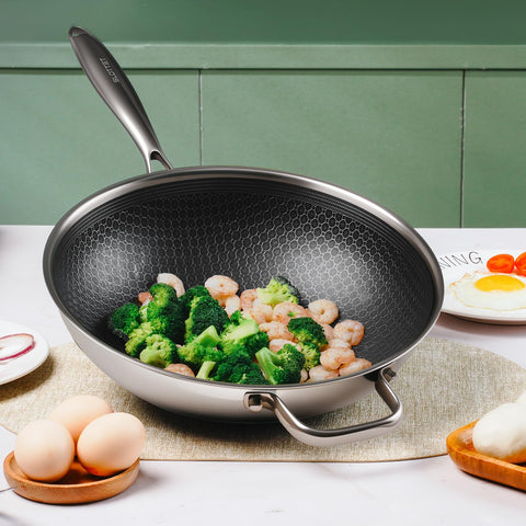 SLOTTET wok beside measuring tools for scale, illustrating generous 12-inch cooking surface