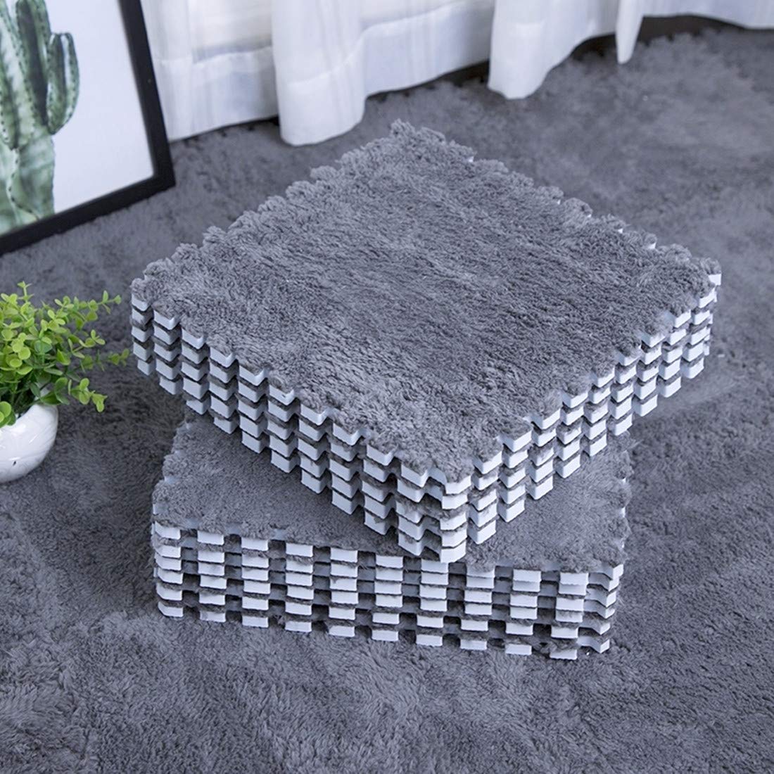 smabee front view of twelve gray interlocking tiles showing packaging and layout benefits