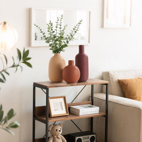 Smiletag vases styled on mantel illustrating layered styling benefit