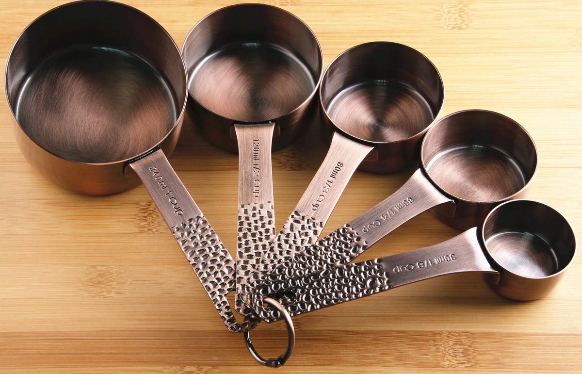 Smithcraft cups and spoons next to common kitchen items for scale