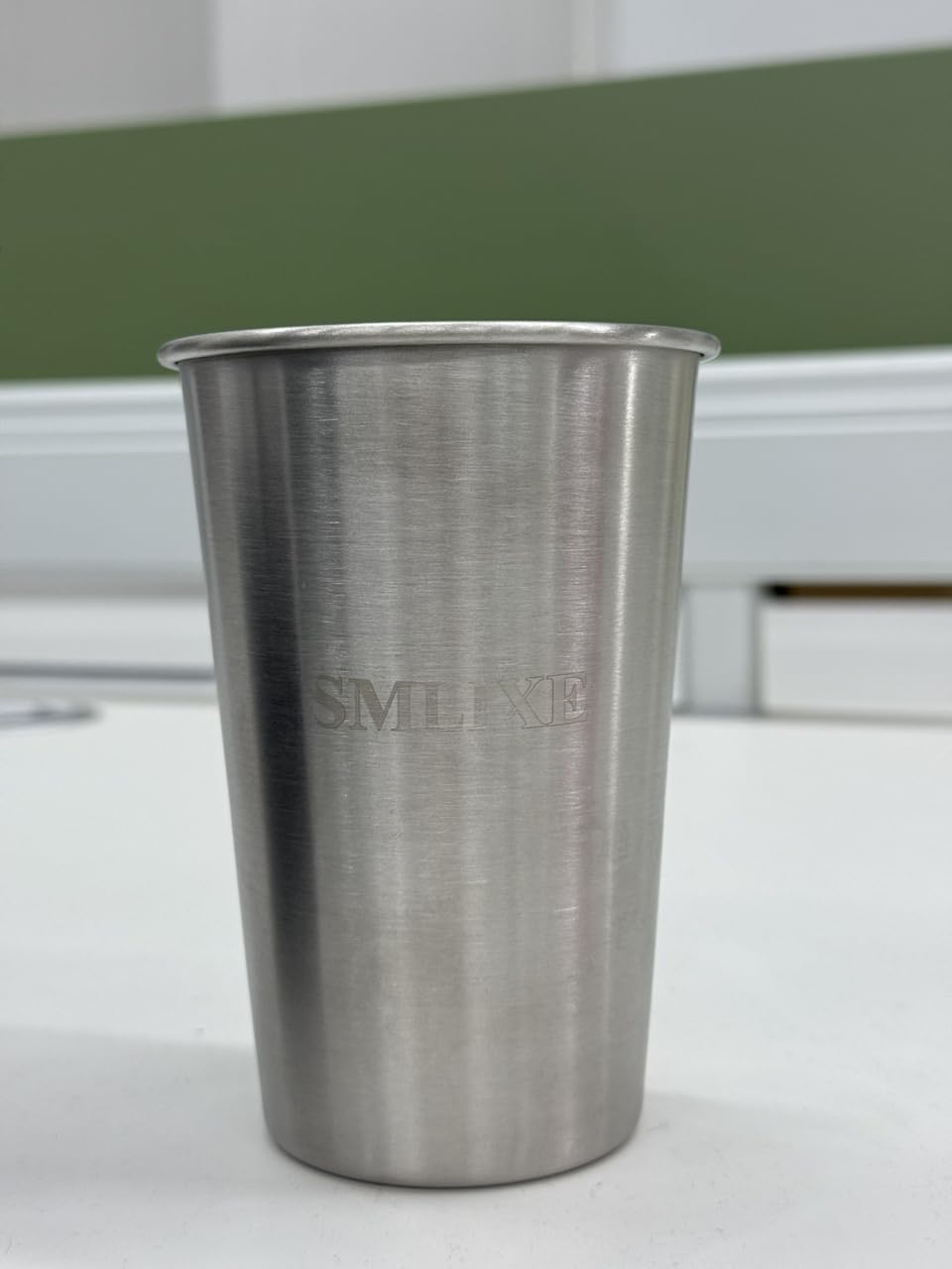 SMLIXE cup held in hand showing 16oz capacity and comfortable grip