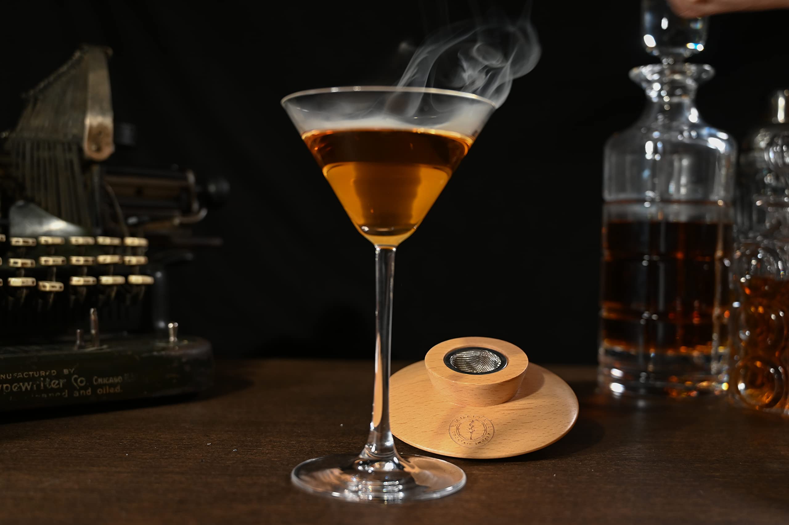 Smokefall wooden cup covers beside whiskey stones showing smoke preservation benefit