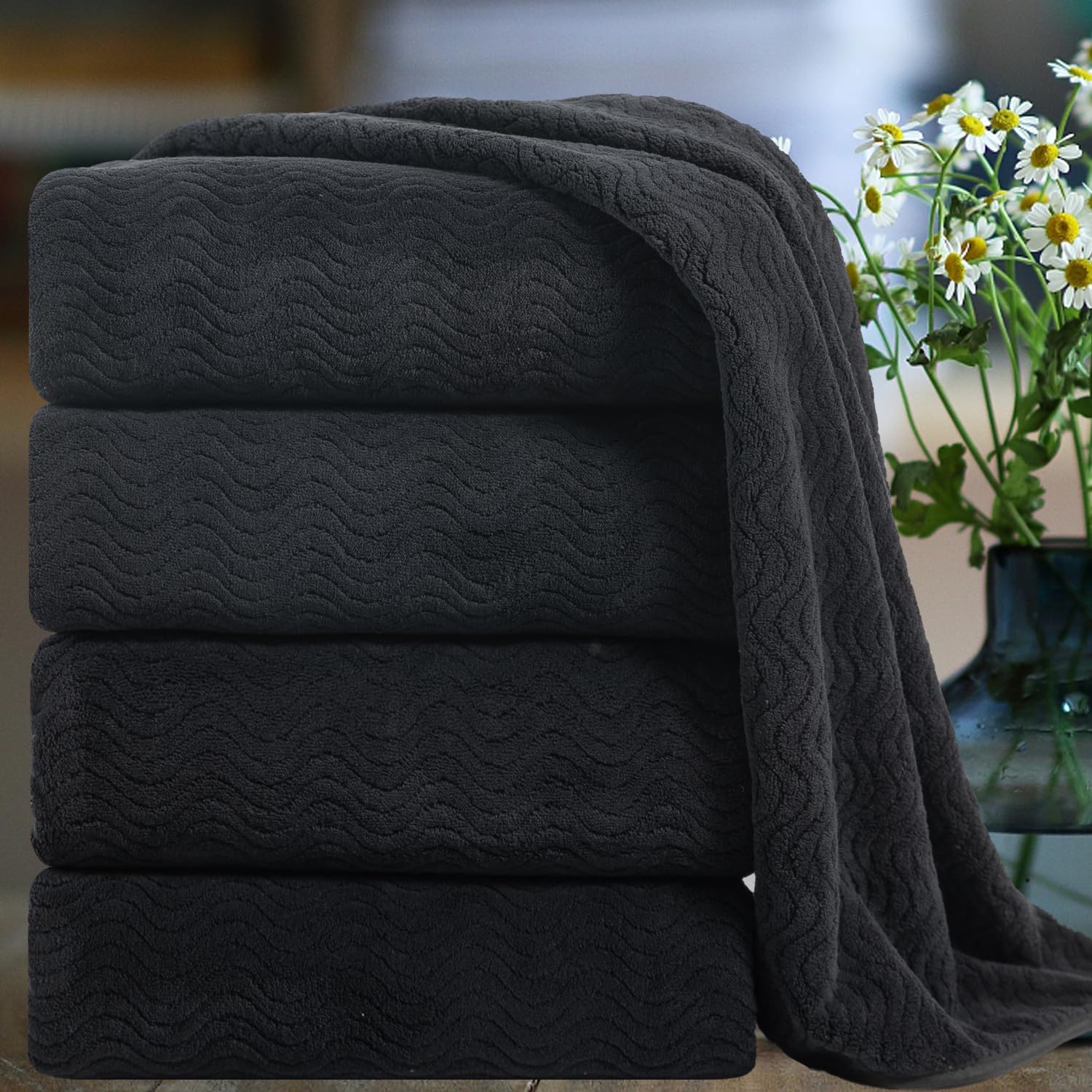 Smuge front packaging showing four black oversized bath sheets and value