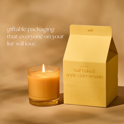 Snif candle on cozy table setting suggesting seasonal home fragrance vibe