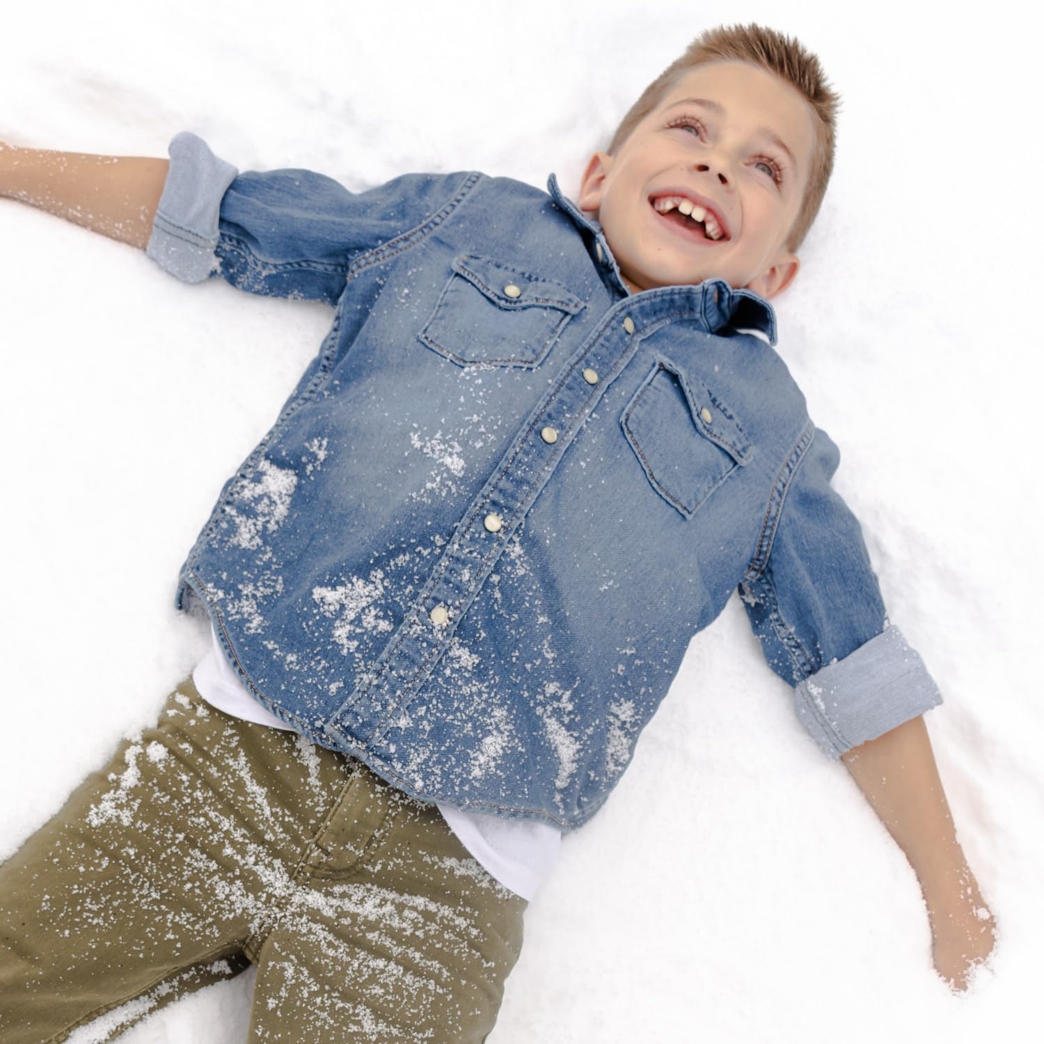 Snow in Seconds hands touching snow demonstrating cold-to-touch realism benefit