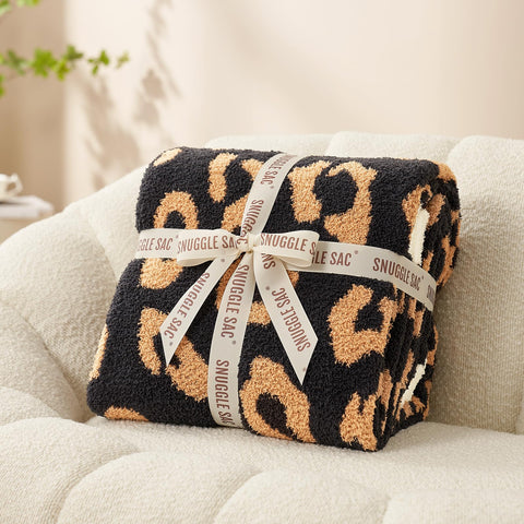 Snuggle Sac used on a picnic blanket showing portable comfort and outdoor utility