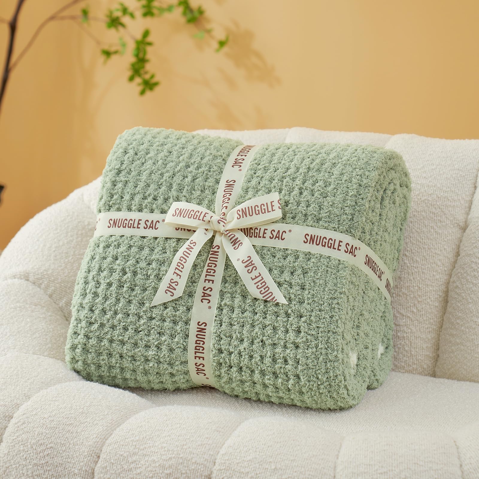Snuggle Sac folded throw wrapped with bow ready for gifting and easy present appeal