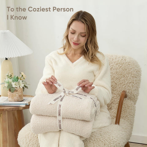 Snuggle Sac blanket next to ruler showing 60x80 size clarity benefit