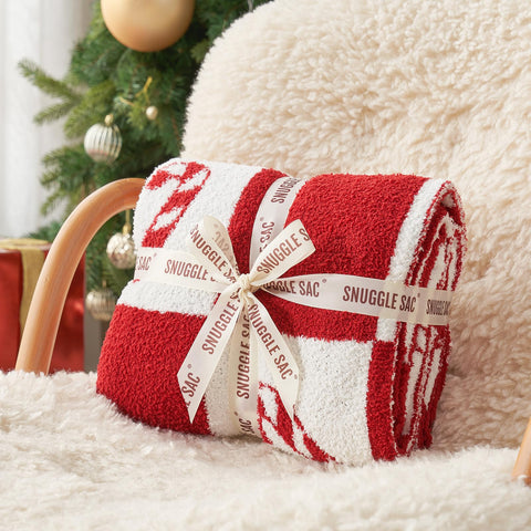 Snuggle Sac folded on sofa highlighting compact storage and decorative use