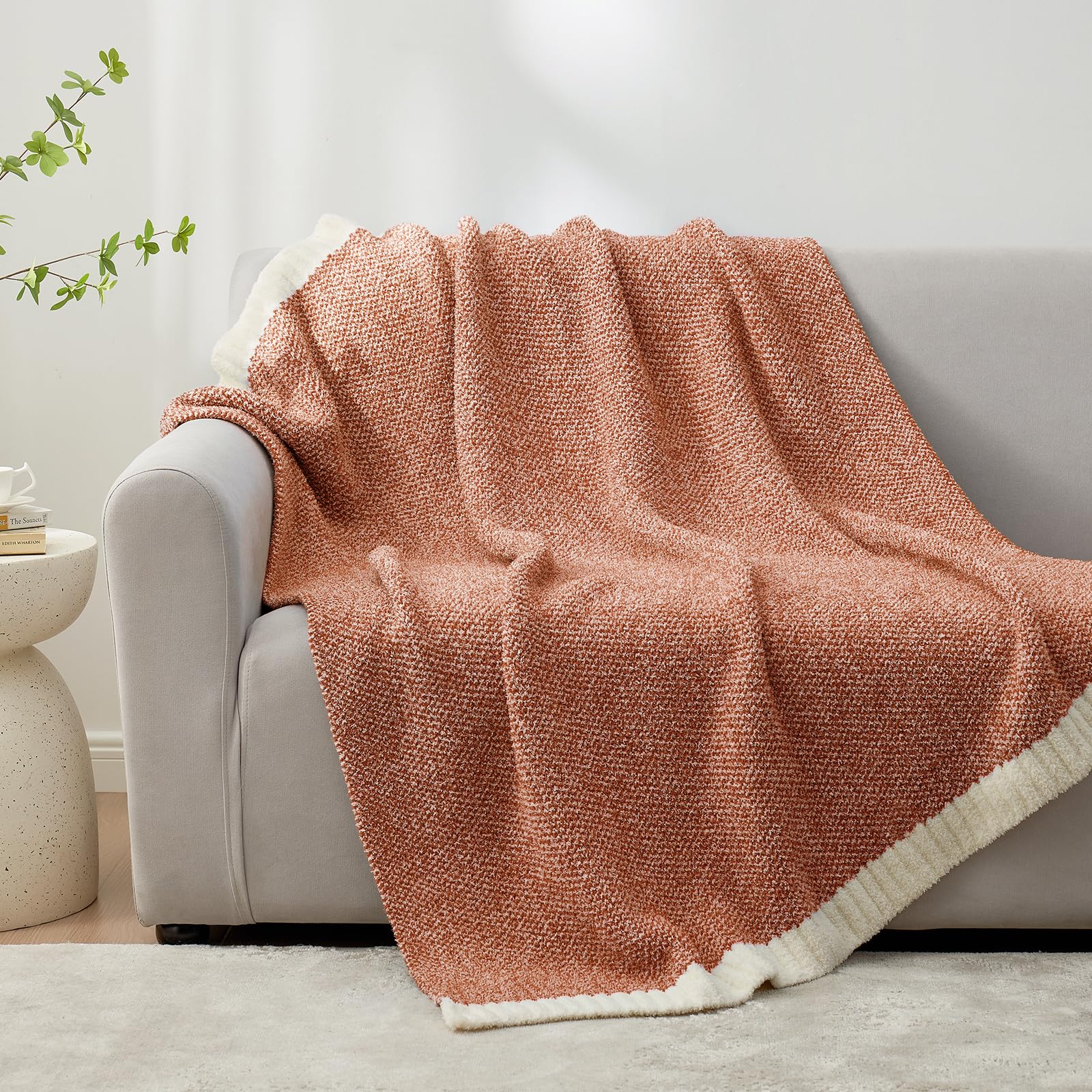 Snuggle Sac draped on sofa illustrating cozy styling and couch protection