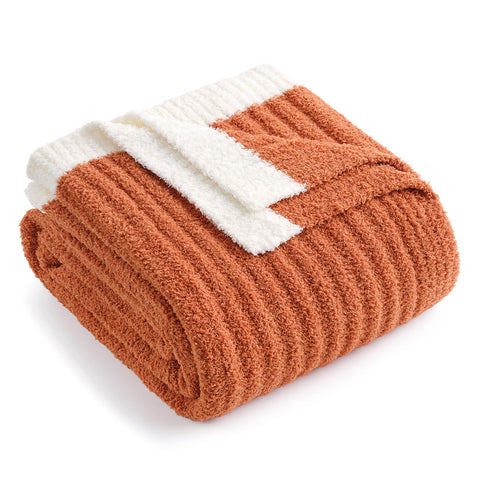Snuggle Sac folded throw front view showing burnt orange warmth and cozy appeal