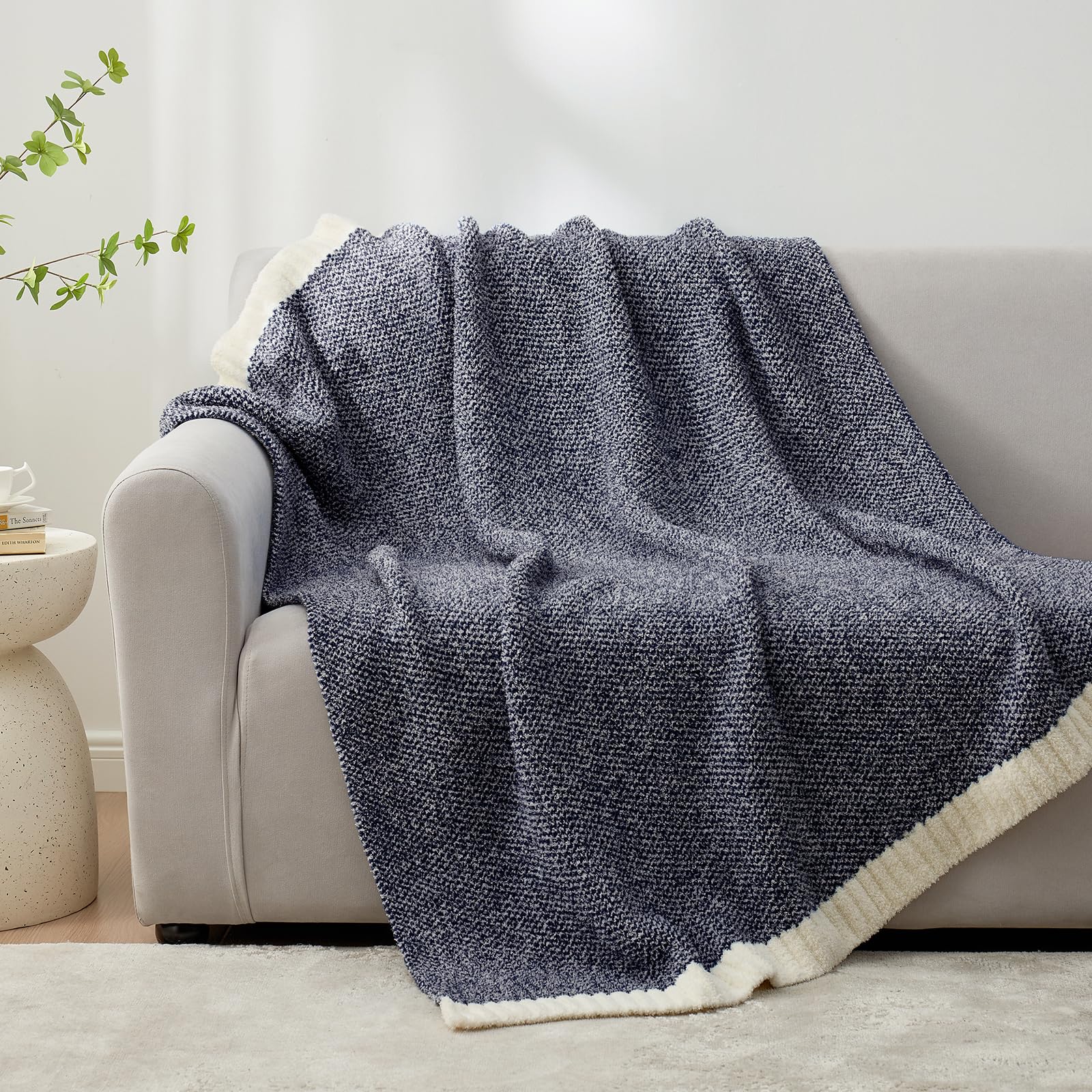 Snuggle Sac throw beside a pillow to show 50x60 size for practical scale reference