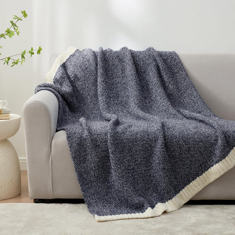 Snuggle Sac throw beside a pillow to show 50x60 size for practical scale reference