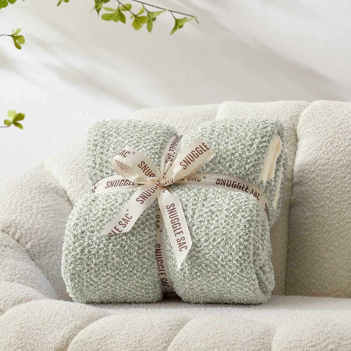 Snuggle Sac folded front view showing plush throw and elegant color