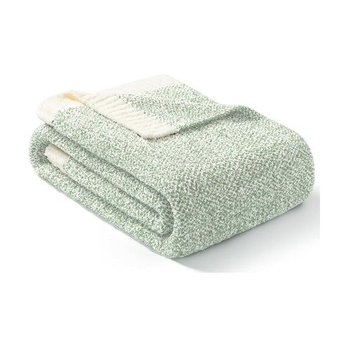 Snuggle Sac layered on bed providing soft, warm bedroom accent