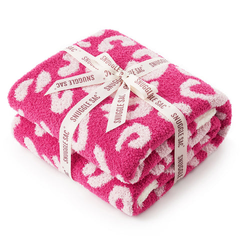 Snuggle Sac front view showing hot pink leopard throw on couch adds instant style
