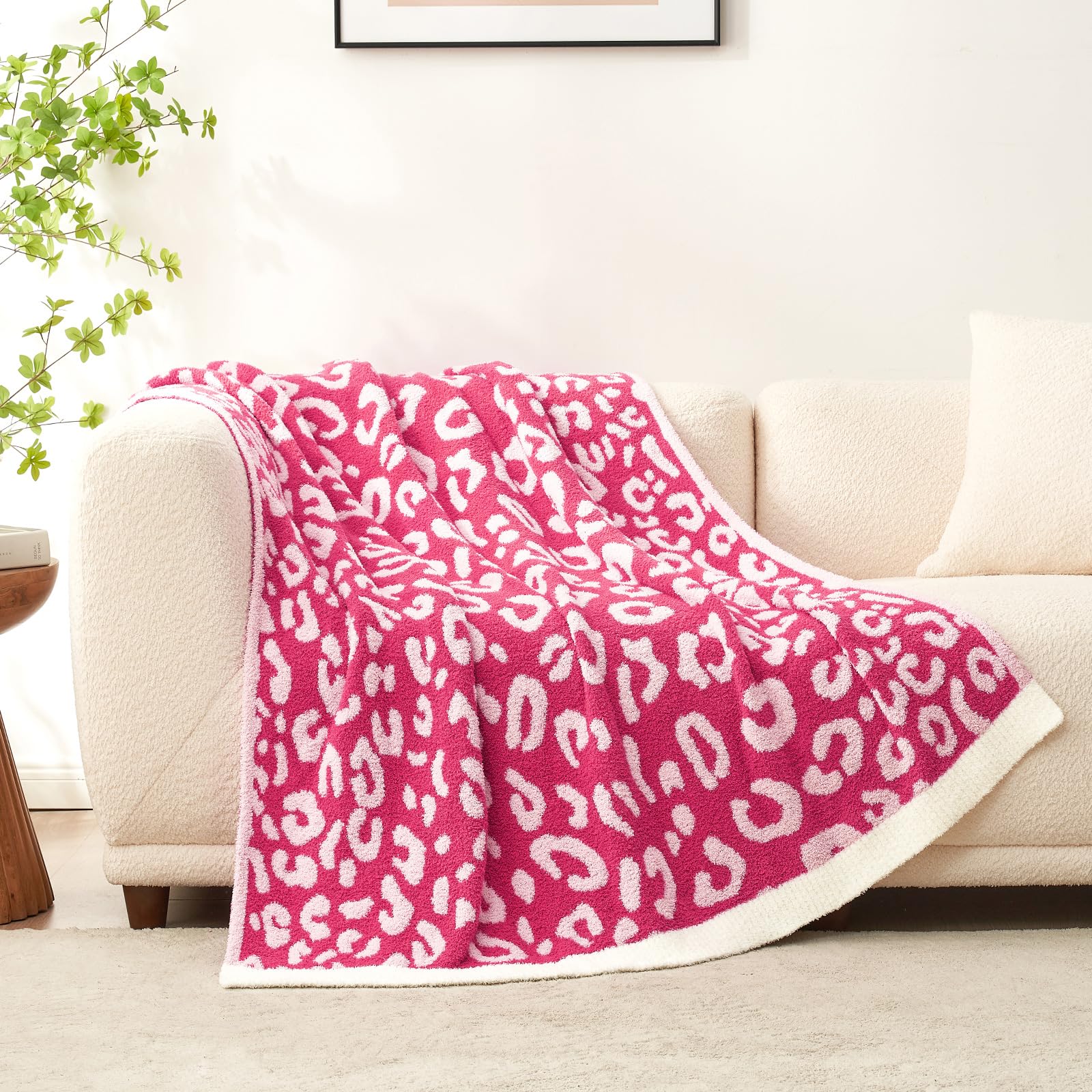 Snuggle Sac draped on sofa showing bold pink accent elevates living room decor