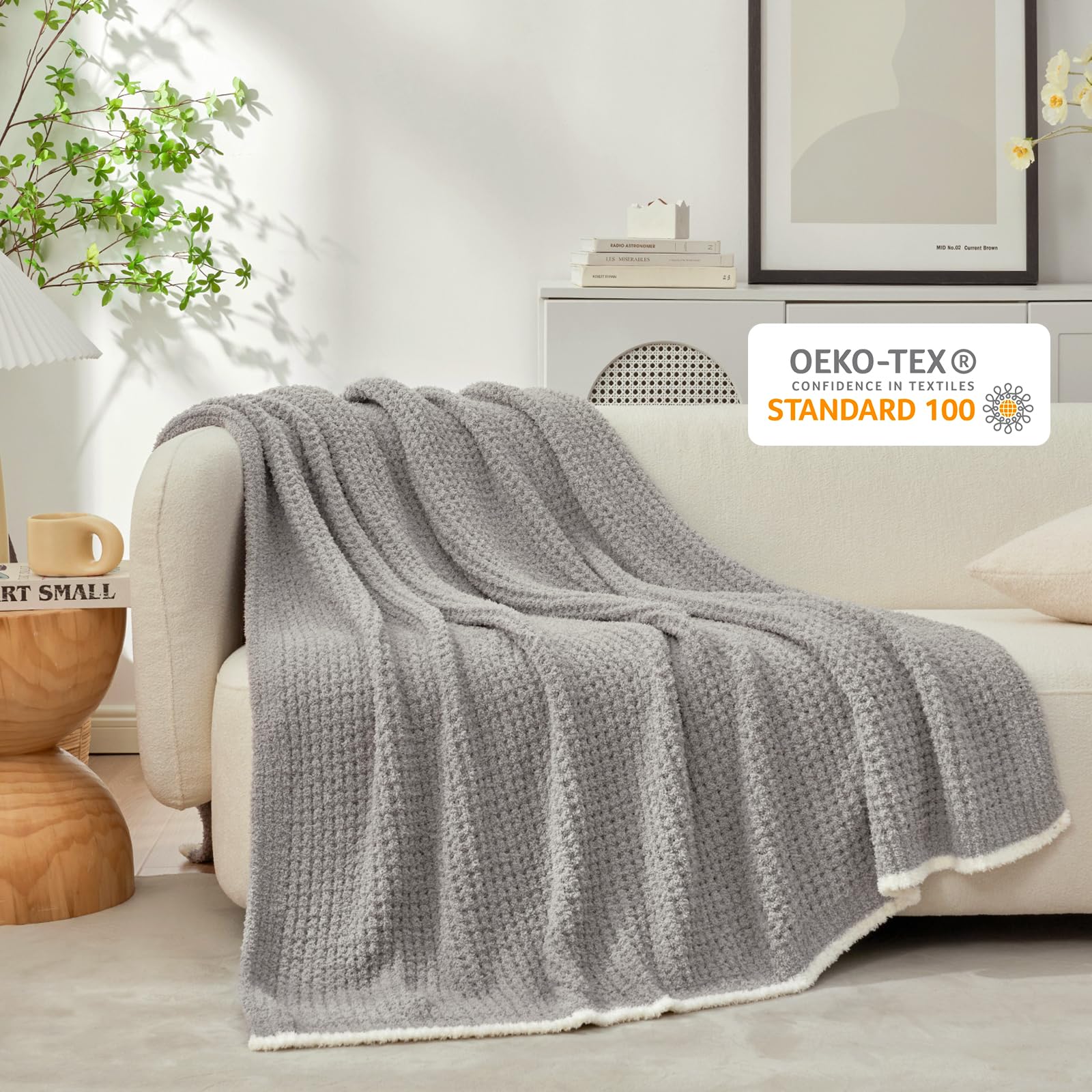Snuggle Sac spread at foot of bed showing reversible grey finish and warmth