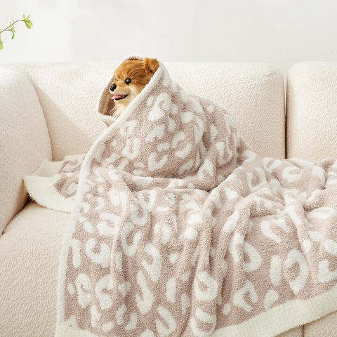 Snuggle Sac spread on sofa in cozy living room for lounging benefit