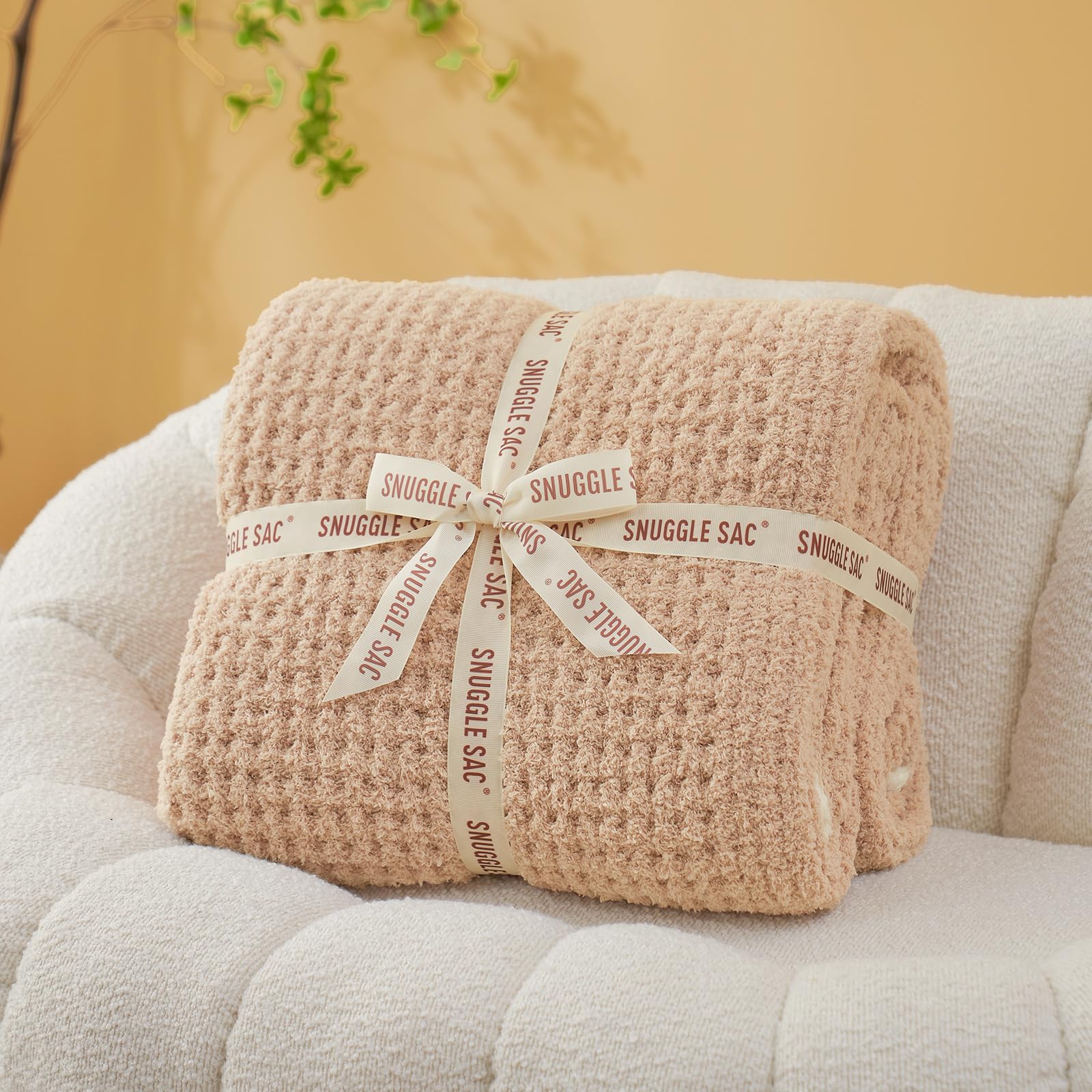 Snuggle Sac on sofa lifestyle shot illustrating cozy family TV night comfort