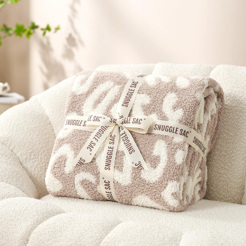 Snuggle Sac reversible side with cheetah print and beige underside for styling