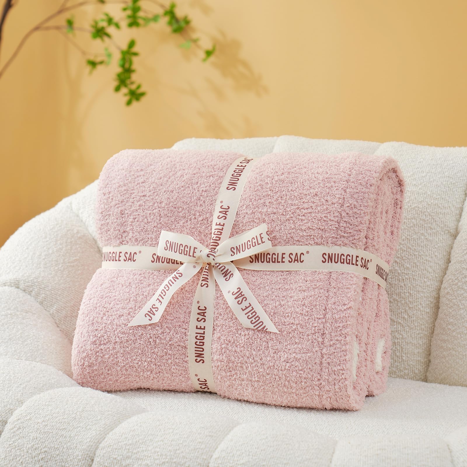 Snuggle Sac reversible side revealed showing dual solid pink styling benefit