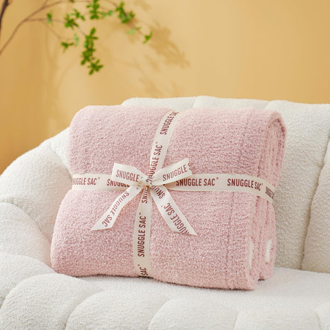 Snuggle Sac reversible side revealed showing dual solid pink styling benefit