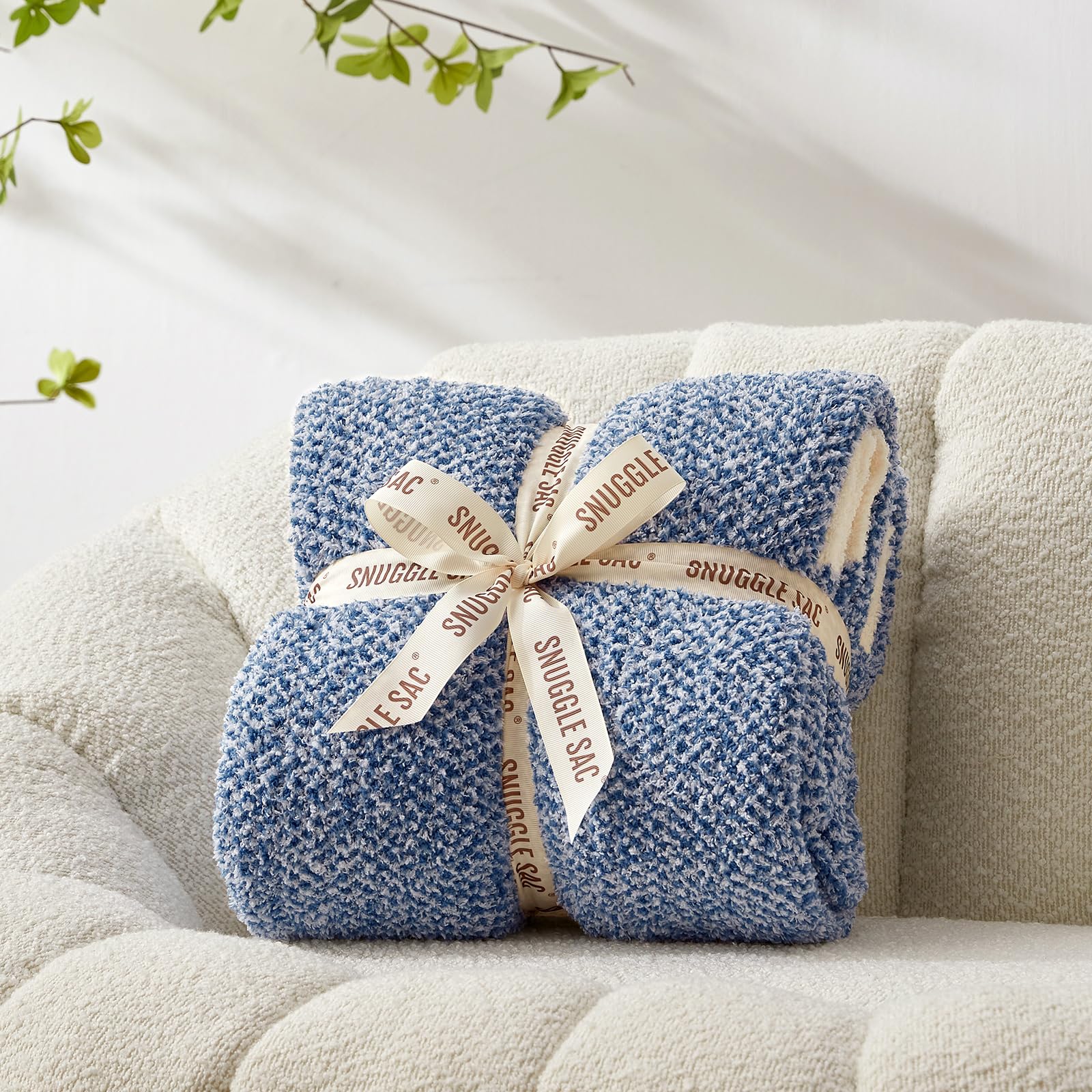Snuggle Sac rolled for travel to show packable, lightweight convenience