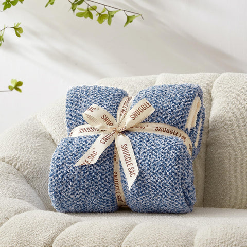 Snuggle Sac rolled for travel to show packable, lightweight convenience