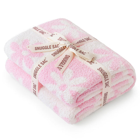 Snuggle Sac displayed on chair to show 50x60 inch size and coverage