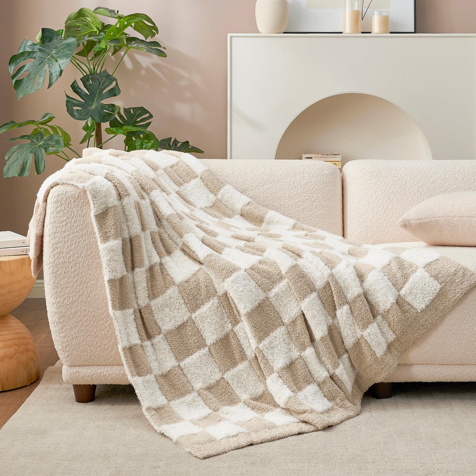 Snuggle Sac throw blanket draped over sofa demonstrating cozy living room styling