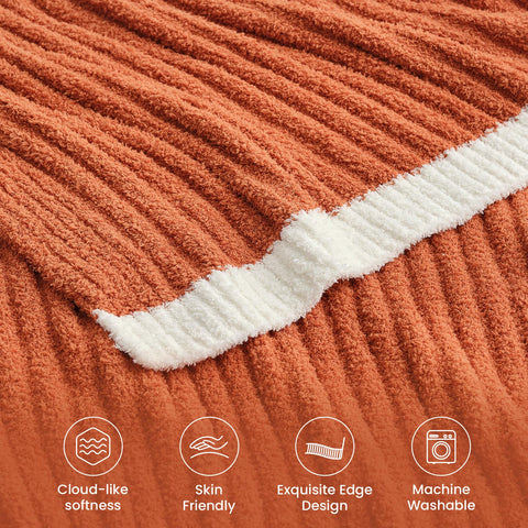 Snuggle Sac throw draped on sofa adding burnt orange accent and visual warmth