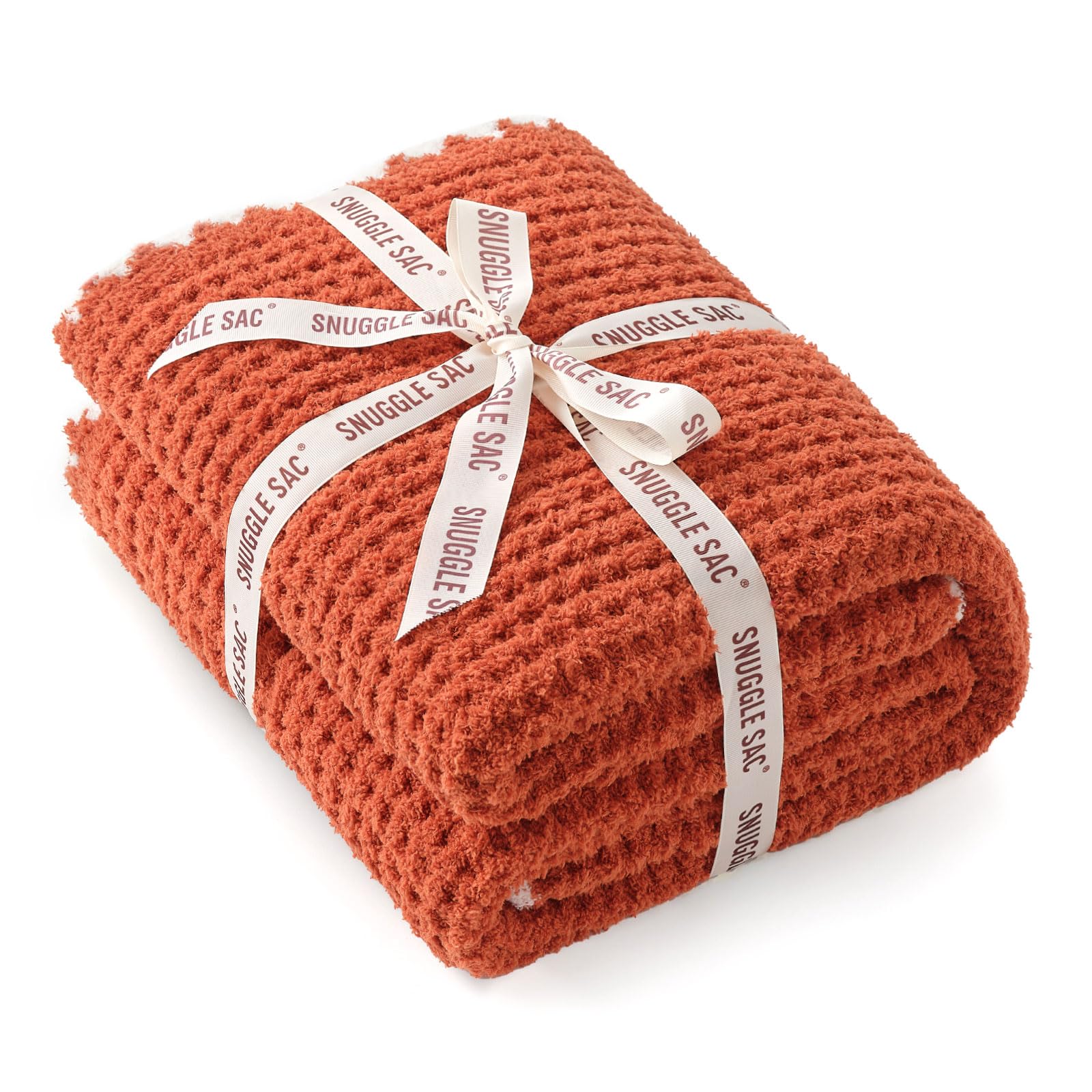 Snuggle Sac orange waffle blanket tied with bow ready as a gift for birthdays and holidays