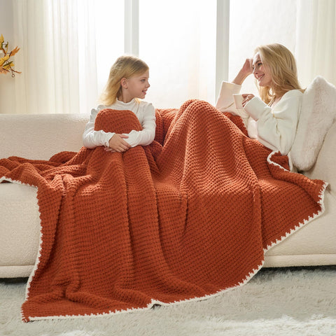 Snuggle Sac blanket draped on sofa in living room demonstrating warm decorative use
