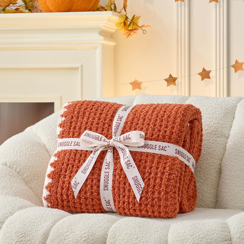 Snuggle Sac reversible side view showing solid orange finish and clean hem benefit