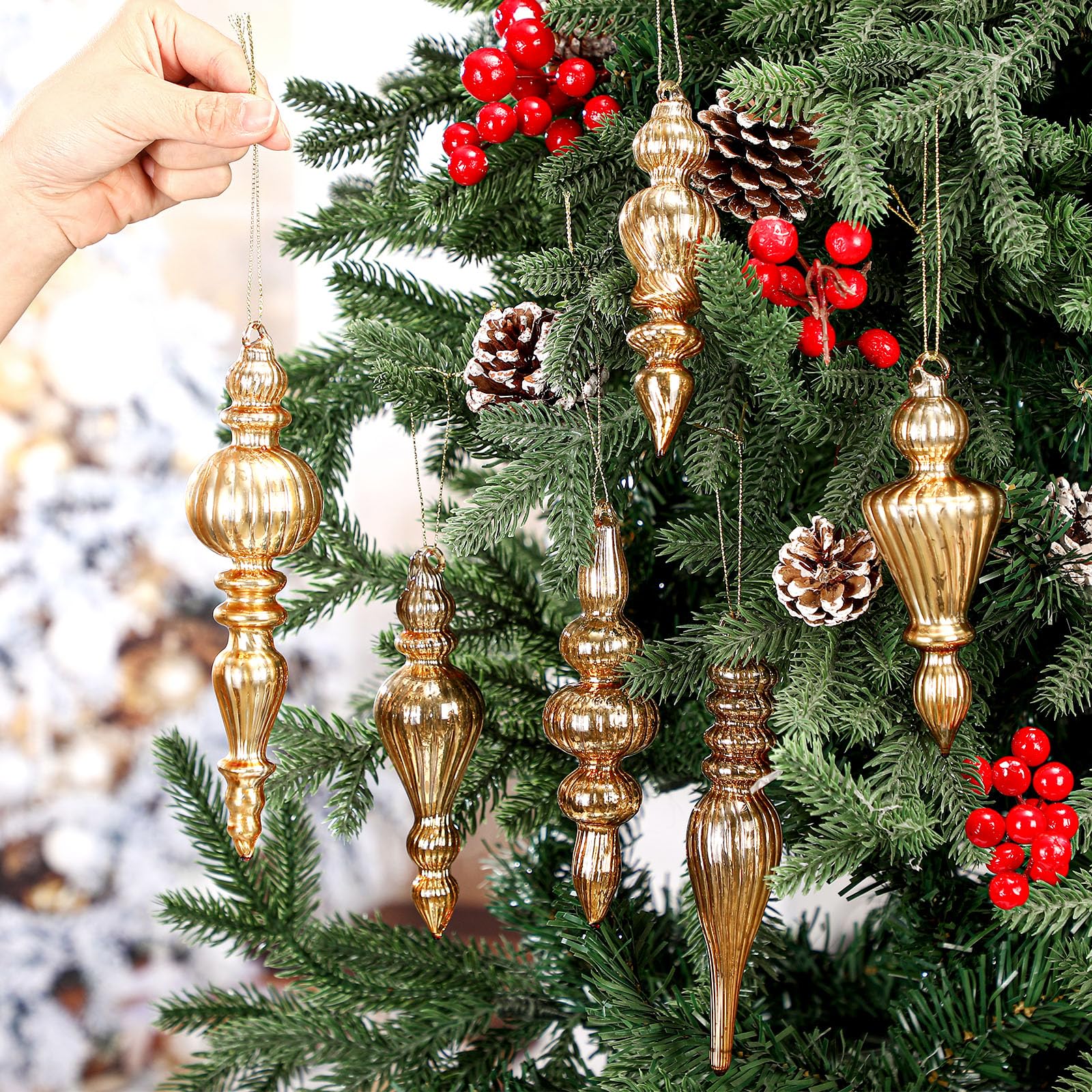 Soaoo single finial hanging on a pine branch adding vertical tree accent