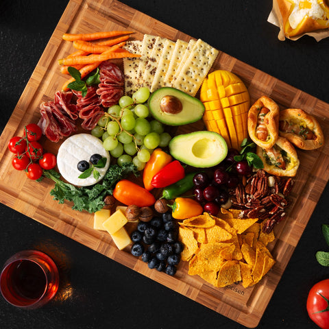 Socisen board next to chef knife illustrating scale and knife-friendly surface