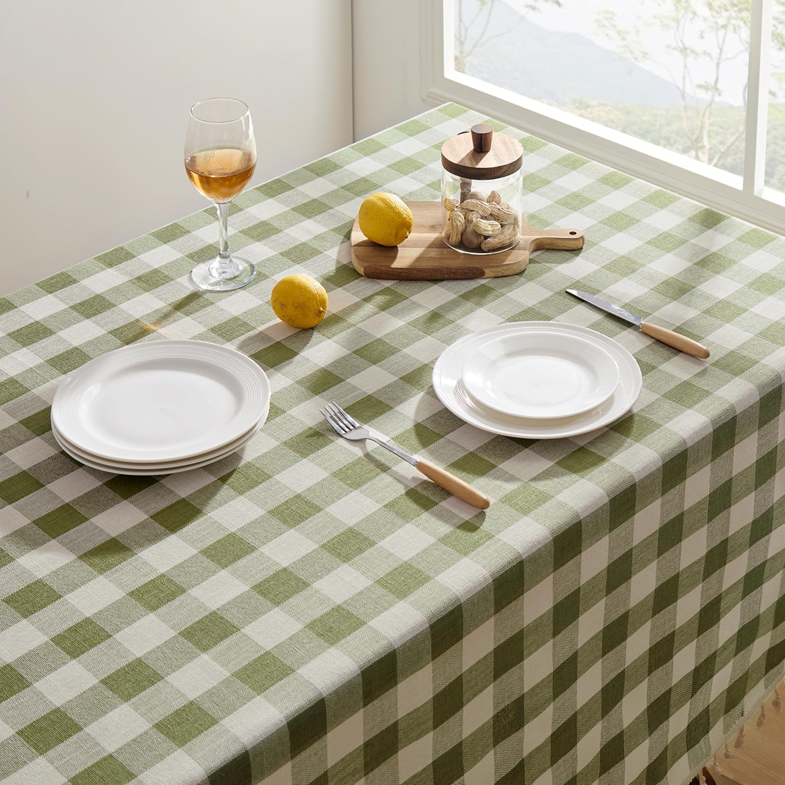 Softalker tablecloth draped on dining table set for dinner, creates inviting atmosphere