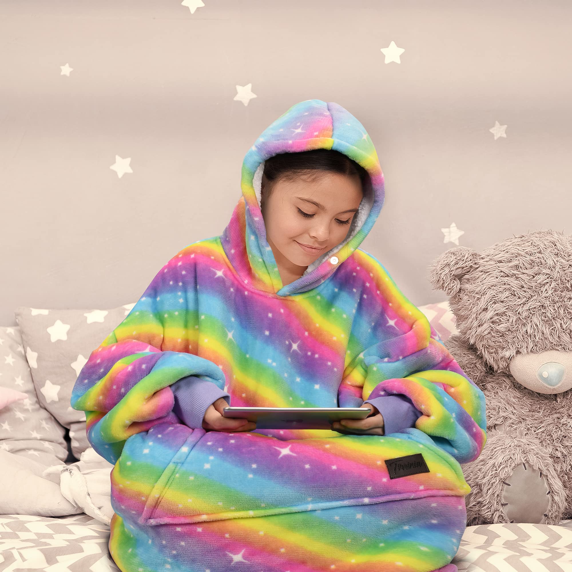 Solaris hoodie length on sofa illustrating generous coverage and comfortable lounging