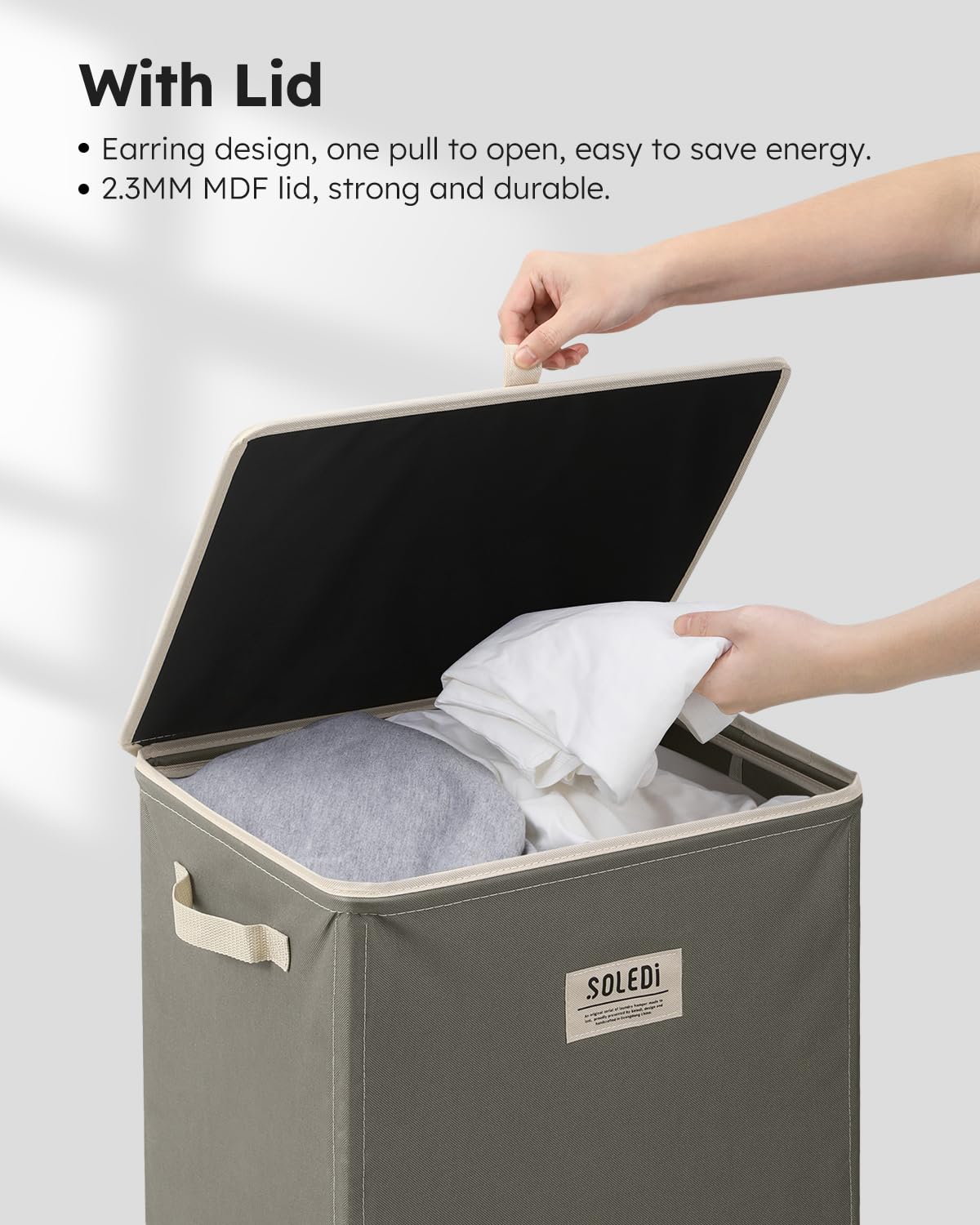 SOLEDI filled hamper placed in bedroom showing large 100L capacity