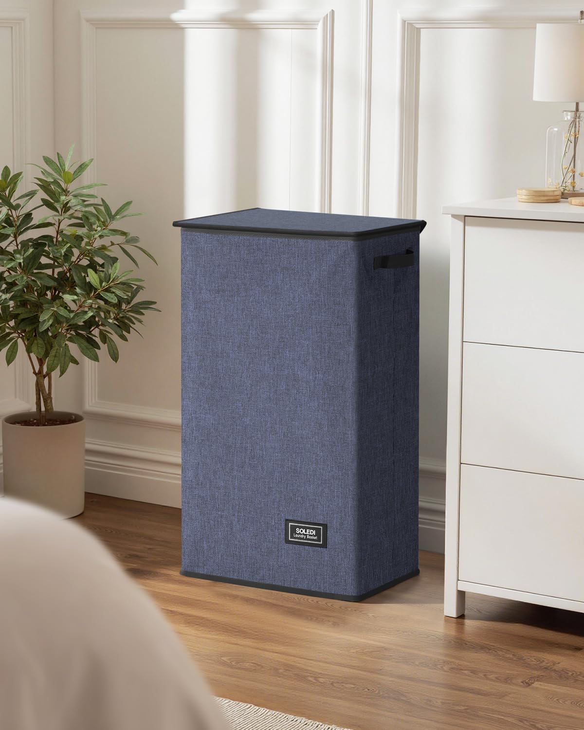 SOLEDI next to chair for scale showing 100L capacity and height